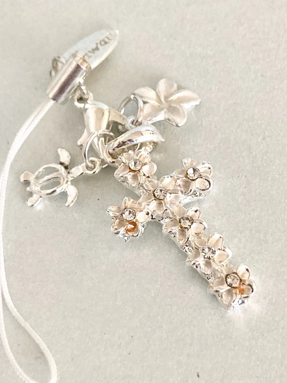 Laule’a Hawaii Floral Cross turtle plumeria silver tone phone charm NWOT